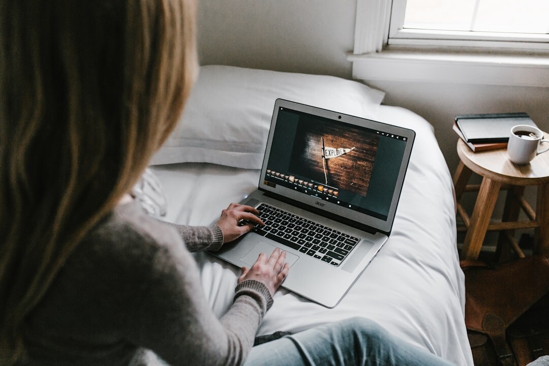 woman editing video on computer